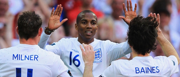 Ashely Young (centre) celebrates his equaliser against Switzerland at Wembley Stadium.